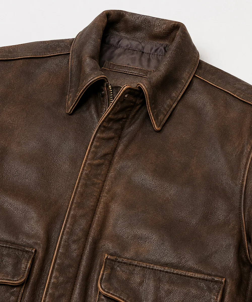 Brown leather flight jacket featuring front flap pockets and side-entry hand pockets