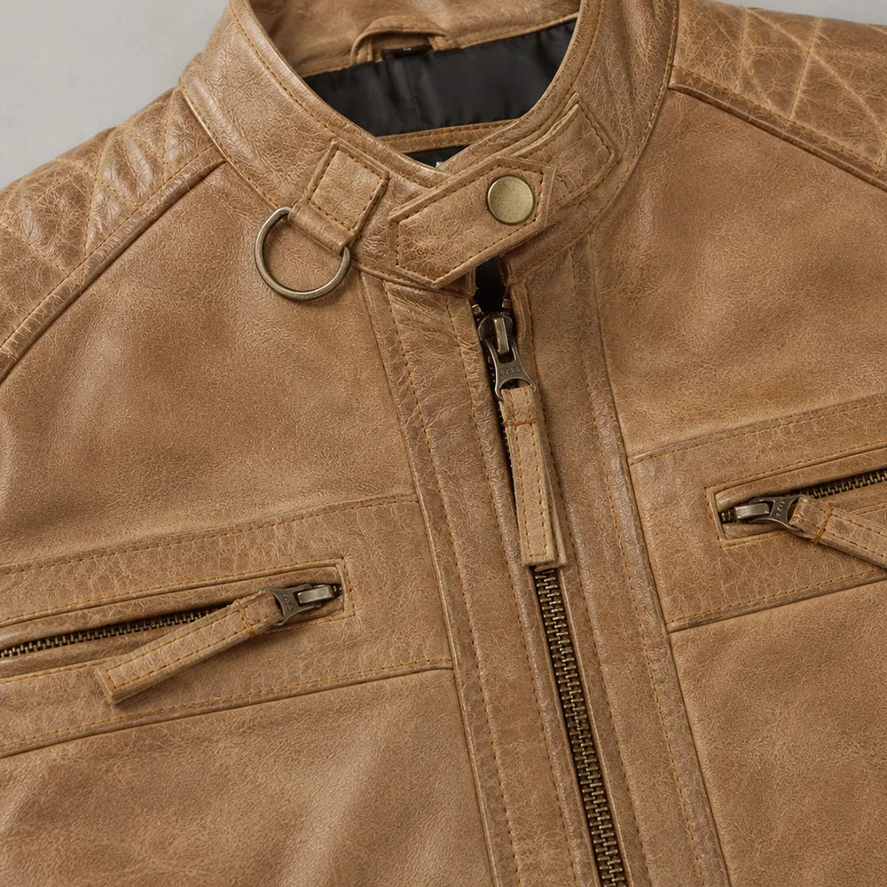 Close-up of camel leather jacket showing premium texture, zipper details, functional pockets, and quality craftsmanship.