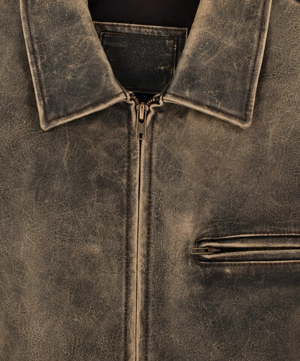 Women wearing a vintage distressed leather jacket with classic zipper closure