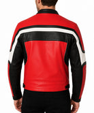 A man viewed from the back wearing a red, black, and white leather jacket with black pants, set against a plain white background.