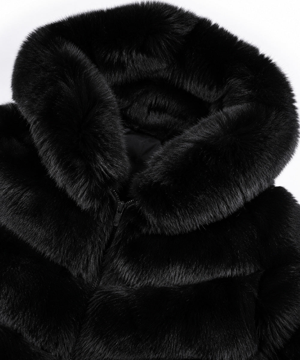 Close-up of a black faux fur coat with a large plush collar and a zipper closure, shown against a plain white background.