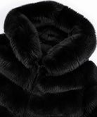 Close-up of a black faux fur coat with a large plush collar and a zipper closure, shown against a plain white background.