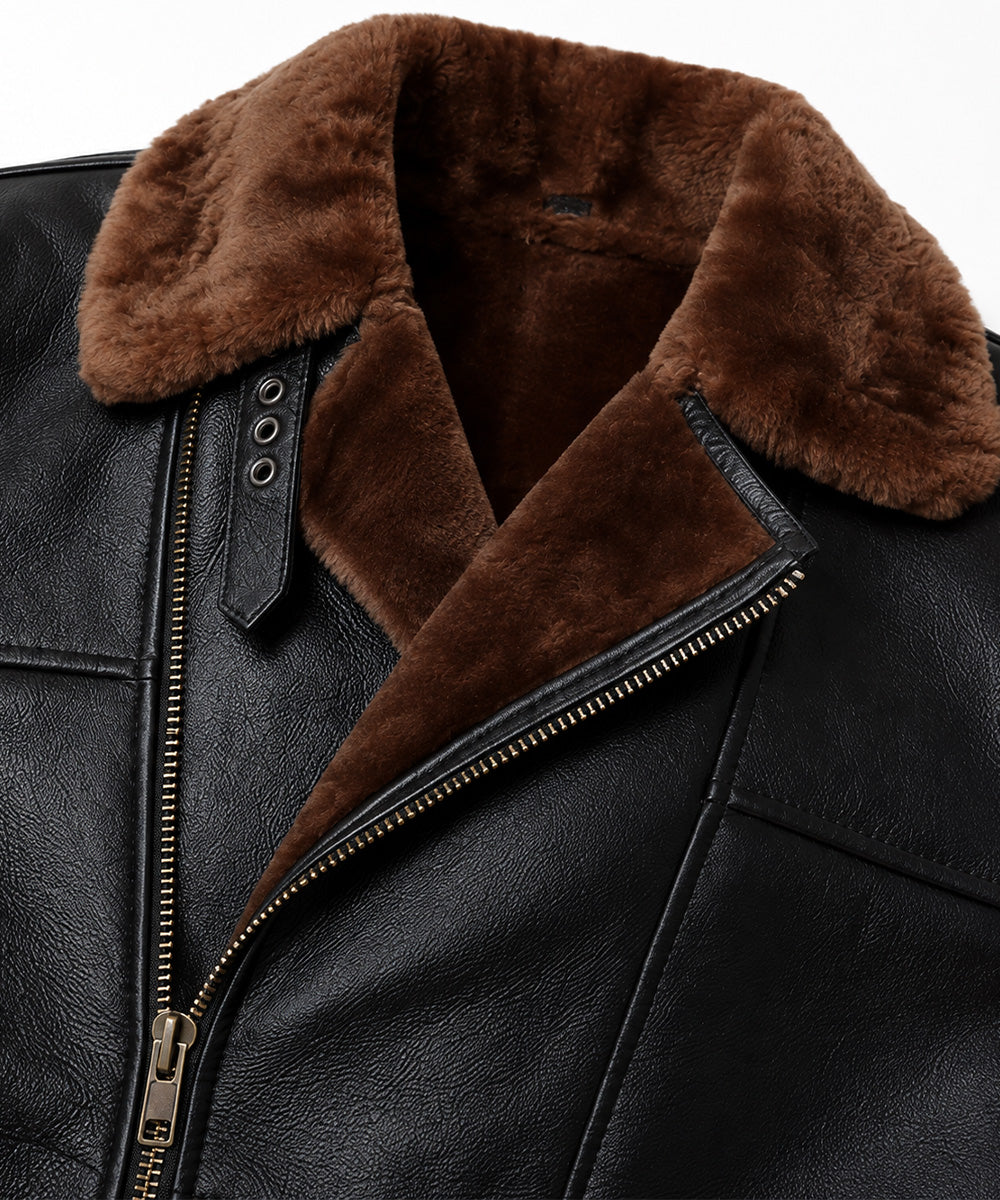 Close-up of brown fur collar, throat strap and brass cross-zip on black sheepskin jacket