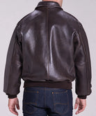 Brown leather flight bomber jacket crafted from genuine cowhide leather with a classic military-inspired A-2 design