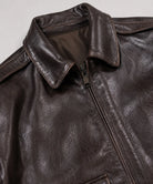 Vintage A-2 leather flight jacket for men with a shirt collar, rib-knit waistband, and authentic aviation-inspired styling.