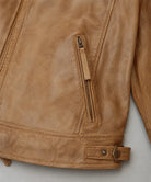 Man wearing Men's Camel Leather Jacket styled with casual outfit for vintage inspired streetwear fashion.