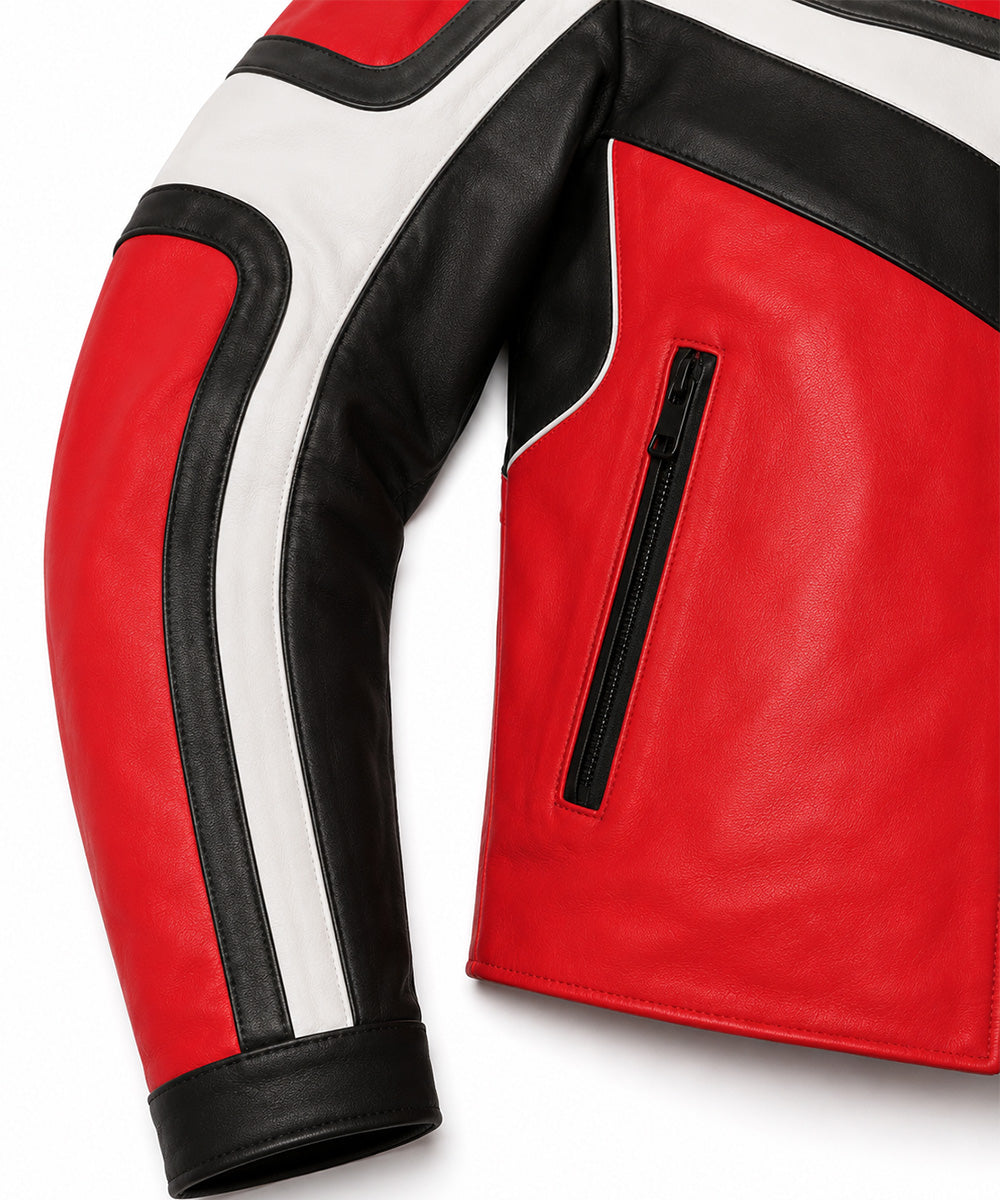 Close-up of a red leather jacket with black and white paneling, showing the sleeve and side zip pocket on a white background.