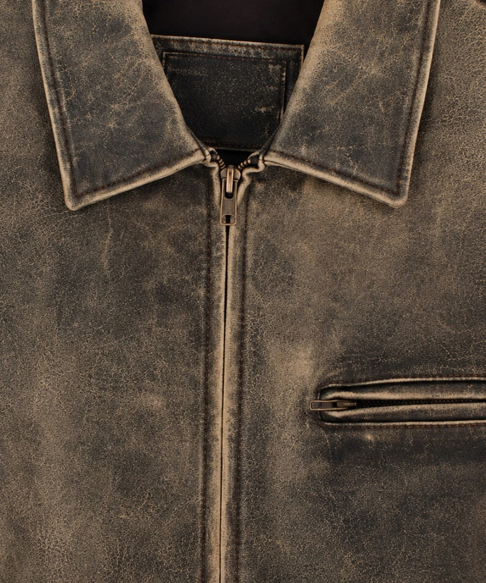 Women wearing a vintage distressed leather jacket with classic zipper closure