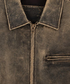 Women wearing a vintage distressed leather jacket with classic zipper closure